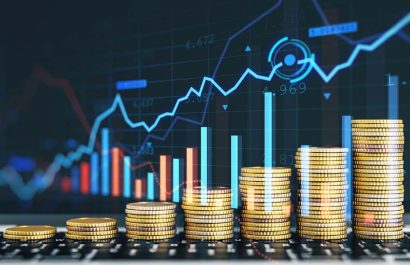 Creative image of growing coin stacks and candlestick forex chart on blurry background. Trade, money and financial growth concept. Double exposure