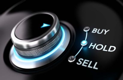Trading platform concept with selector knob positioned on the word hold over black background and blue light. Concept image for illustration of stock market orders and simplicity.