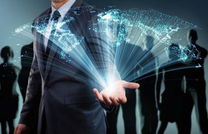 businessman showing global connection with business people on background
