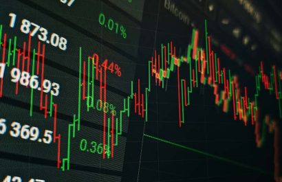 Technical price graph and indicator, red and green candlestick chart on blue theme screen, market volatility, up and down trend. Stock trading, crypto currency background.