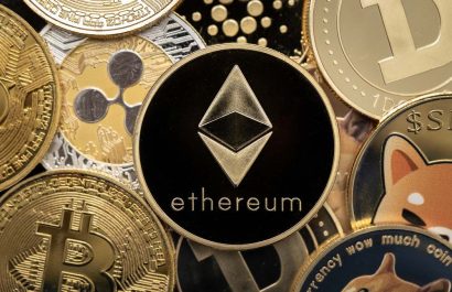 KAUFBEUREN, GERMANY - DECEMBER 04, 2021. Ethereum cryptocurrency coin close-up, on top of other cryptocurrency coins.