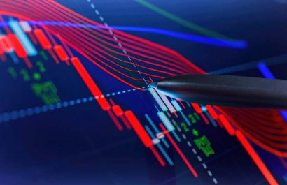 Price chart and pen indicator on screen, red and green candlestick chart on blue screen theme, market volatility, uptrend and downtrend.