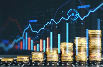 Creative image of growing coin stacks and candlestick forex chart on blurry background. Trade, money and financial growth concept. Double exposure