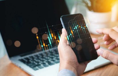 Businessmen investor think before buying stock market investment using smartphone to analyze trading data. trader is showing a growing virtual hologram stock on smartphone. Financial stock market.