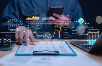 Market Analysis and Trading Insights, Trader analyzes graphs and data on digital devices, modern financial technology for market evaluation and decision-making in dynamic environment