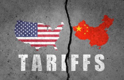 Flag map of US and China painted on cracked wall. China and United States of America trade and tariffs, customs war.